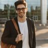 happy-businessman-in-eyeglasses-looks-into-camera-and-smiles-sincerely-brunette-guy-in-black-jacke-quuy494uxehhpoau4fypyyhwji56hw5bv7rcsyjd68